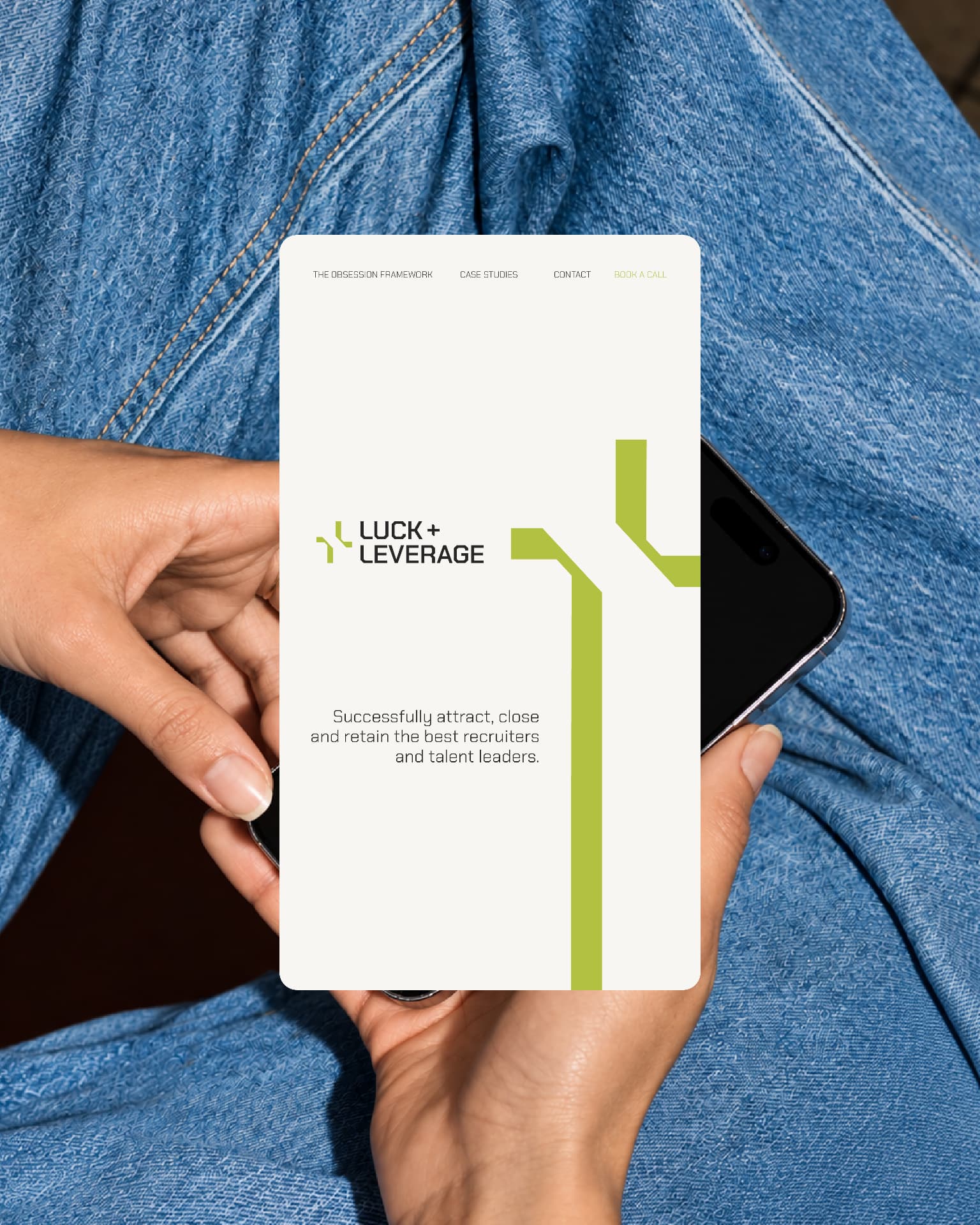 Luck & Leverage mobile site held in hand